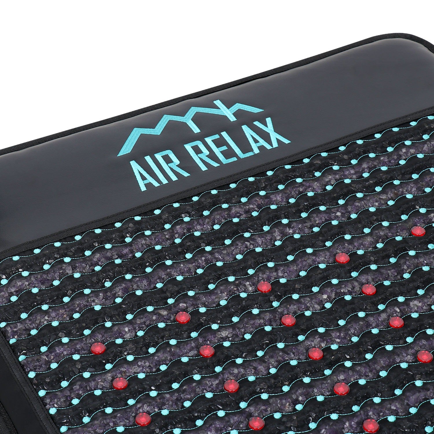 Close-up of an 'AIR RELAX' device with a grid pattern and red and blue lights.