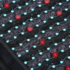 Close-up of a textured surface with red and blue circular patterns